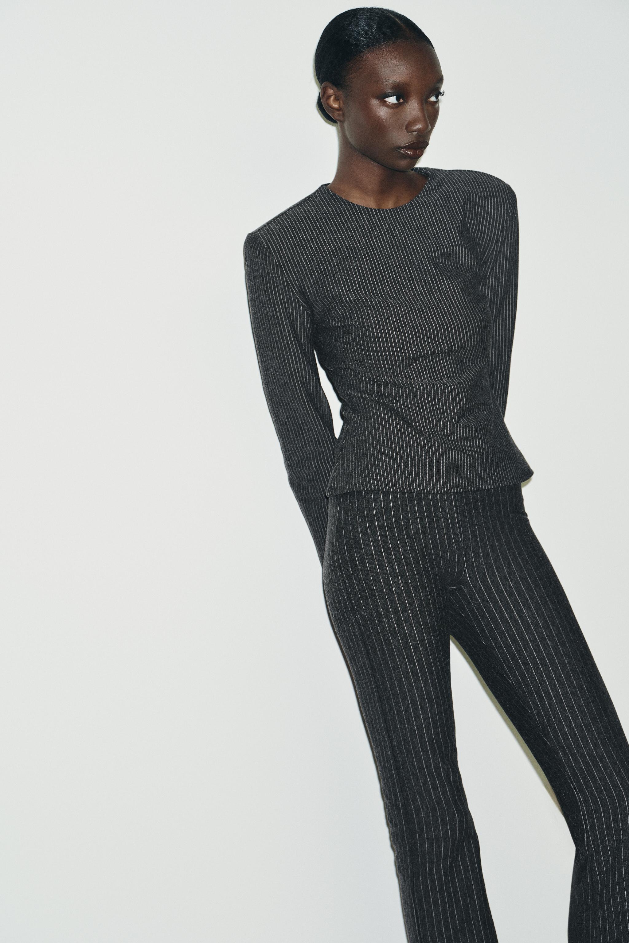 PINSTRIPED SHOULDER PAD TOP